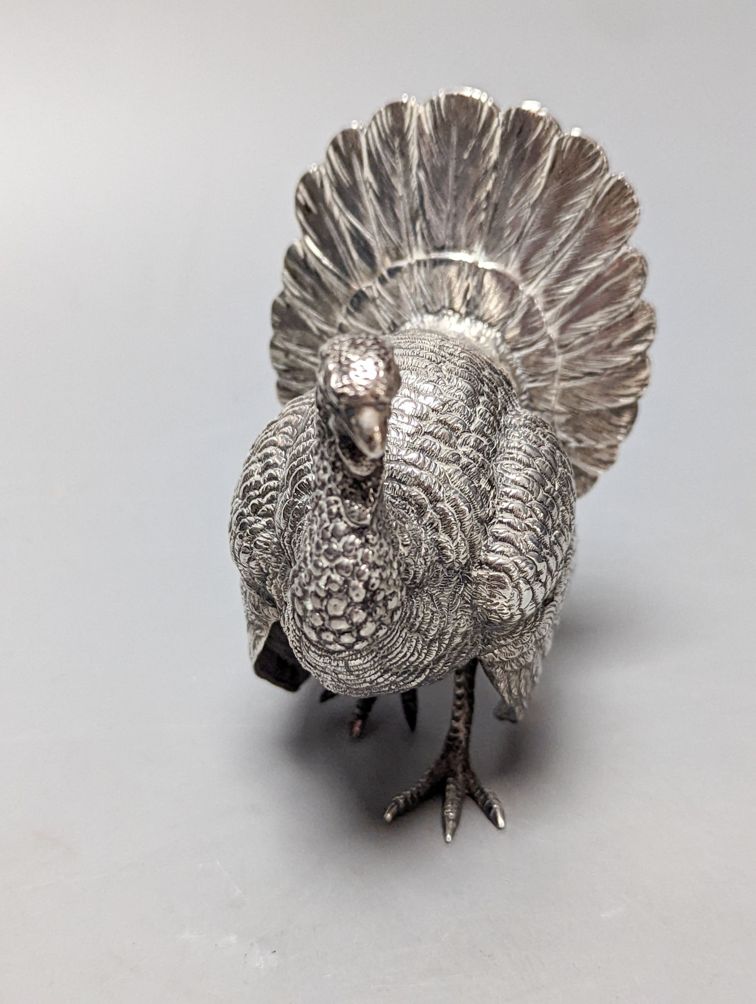 A late 19th /early 20th century Hanau silver free standing model of a game bird, 1930's import marks, height 10.4cm, 180 grams.